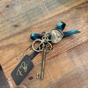 Nwt elegant Key Charm with Ribbon Accent heart key antique looking